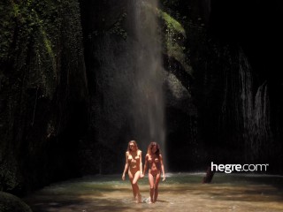 Two beauties by way of the waterfall in paradise