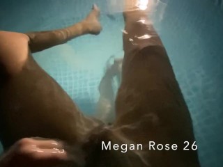 Lesbian couple taking part in within the pool on holiday