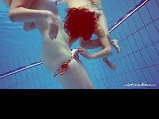 Blonde and Brunette babes swim bare